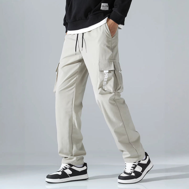 Men's cargo joggers with elastic waistband, side flap & zipper pockets Mune Fashion