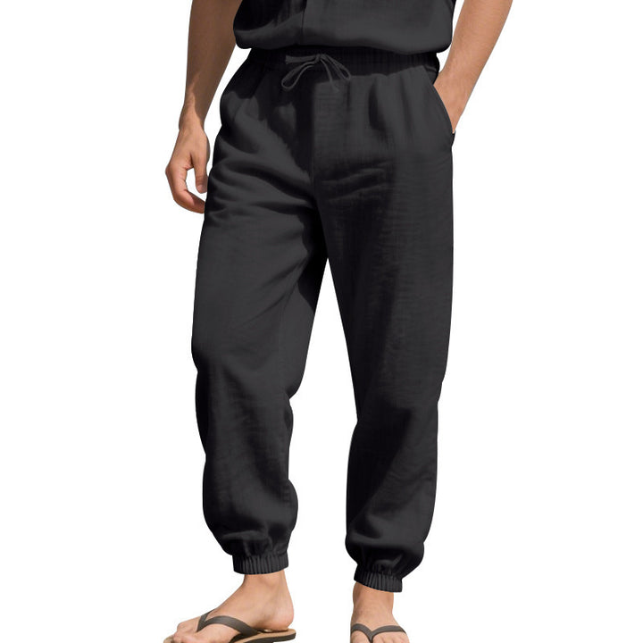 Men's light linen pants with elastic tunnel drawstring waistband, side pockets, and smocked cuffs Mune Fashion