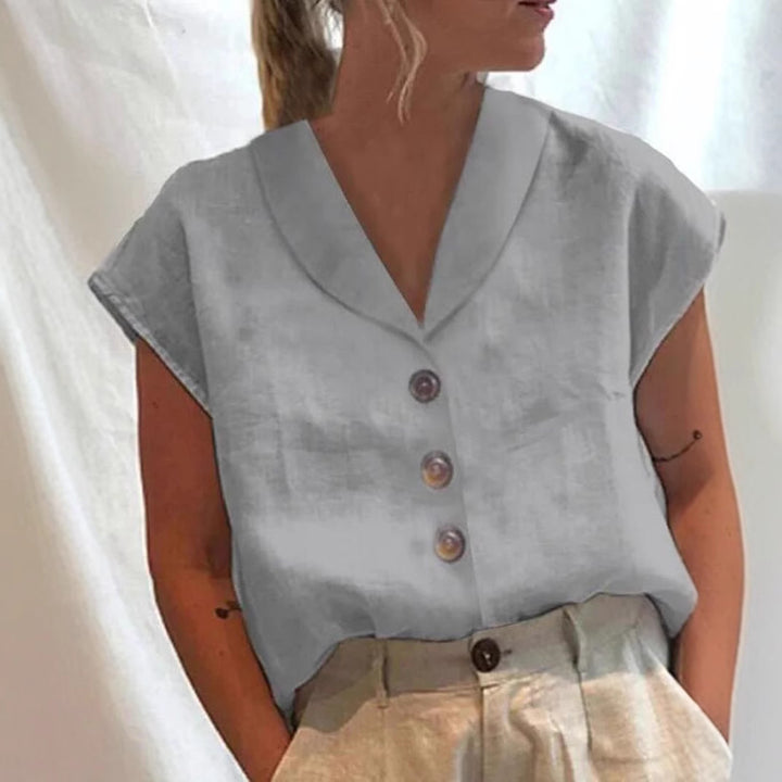 Women's airy linen blouse with wide V-neck, dropped shoulder and decorative button placket Mune Fashion