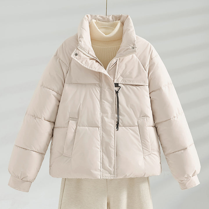 Women's non-short padded boxy jacket with high stand-up collar, drawstring chest closure, and slanted flap pockets Mune Fashion