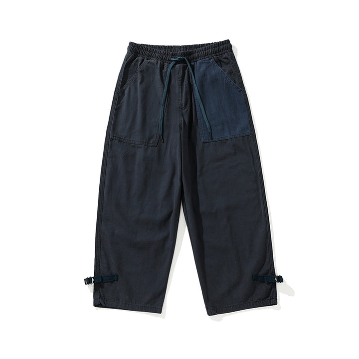 Men's wide cropped cargo pants with elastic drawstring waistband, patch pockets and adjustable ankle straps Mune Fashion