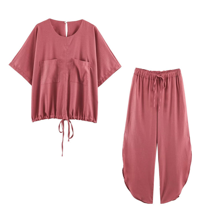 Ladies loose-fitting harem pants with drawstring waistband, mid-slit, and rounded hem Mune Fashion