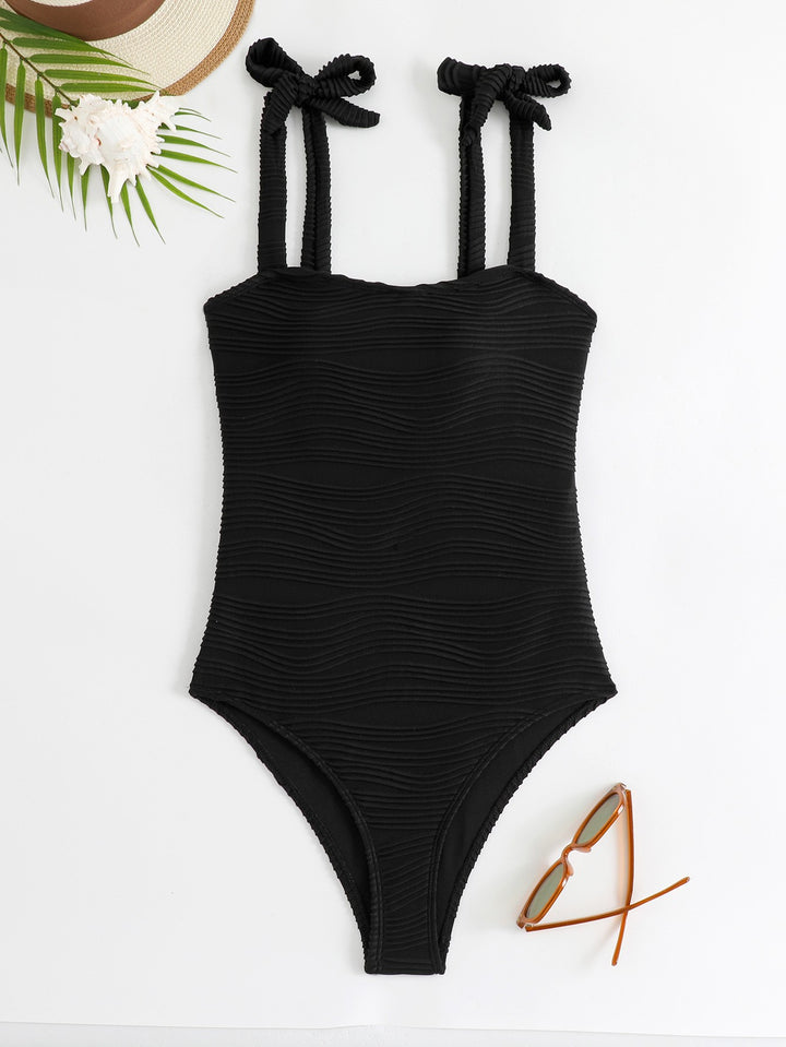 Women's figure-fitting one-piece swimsuit with playful bow details Mune Fashion