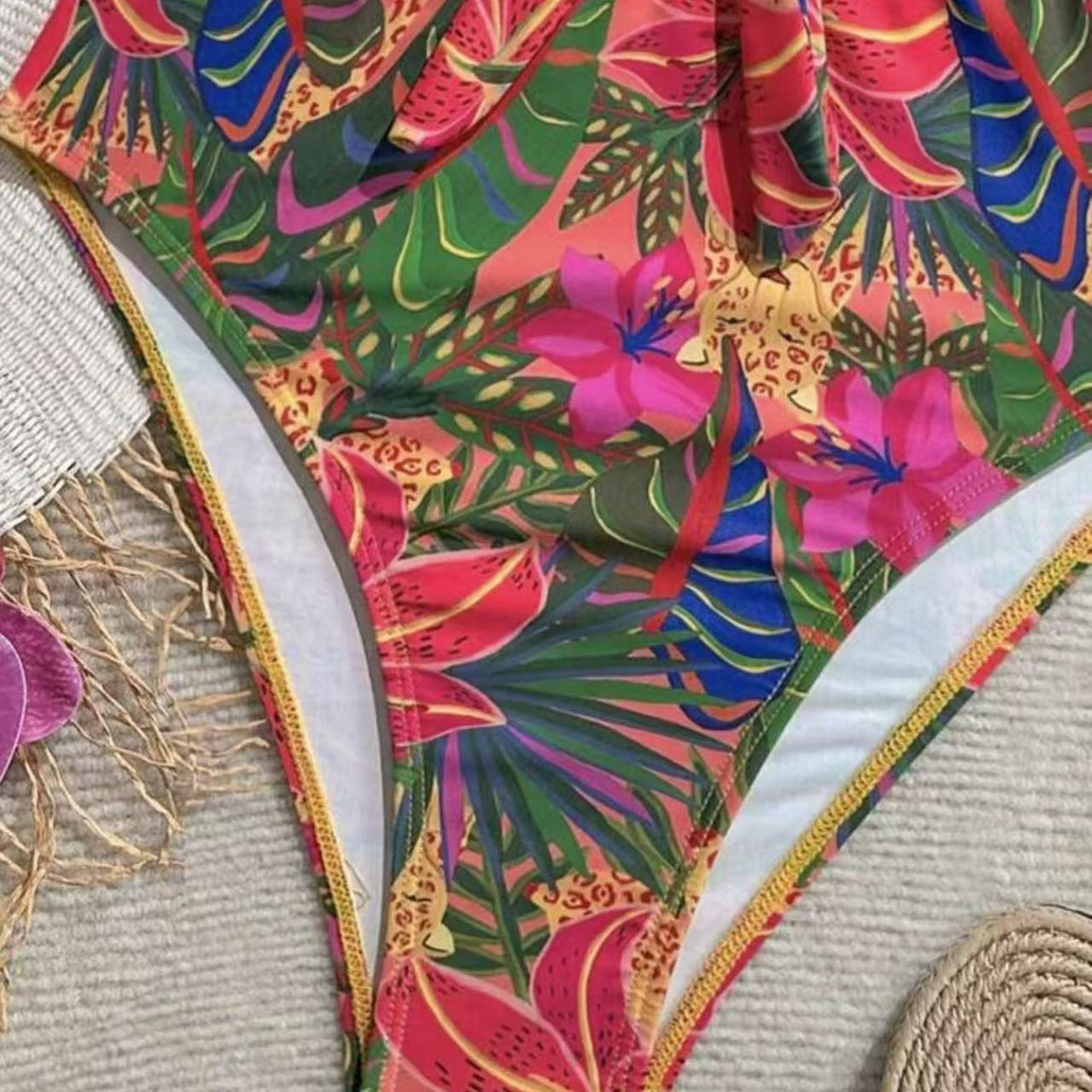 Women's one-piece swimsuit with decorative knot detail and playful floral design Mune Fashion