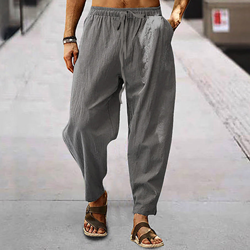 Men's loose linen casual pants with elastic tunnel drawstring waistband, low crotch, and tapered ankle length Mune Fashion