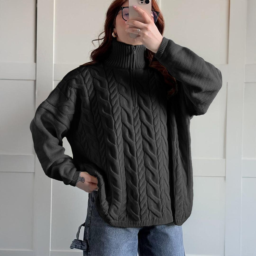 Women's oversized cable knit turtleneck sweater with half zip, high stand-up collar, and rounded hem Mune Fashion
