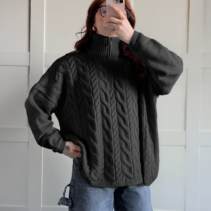 Women's oversized cable knit turtleneck sweater with half zip, high stand-up collar, and rounded hem Mune Fashion