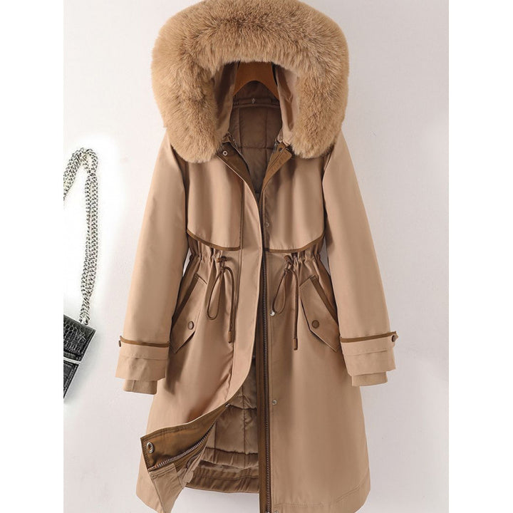 Women's long parka with faux fur hood, waist drawstring, and contrasting piping Mune Fashion