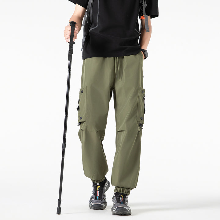 Men's Wide Technical Cargo Jogger with elastic drawstring waistband, multifunctional cargo pockets and adjustable leg openings Drune