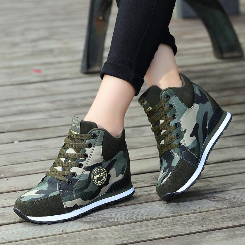 Women’s mid-high wedge running sneakers in a material mix with concealed inner wedge, padded ankle collar, and grippy tread sole Mune Fashion