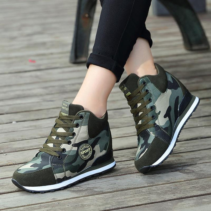 Women’s mid-high wedge running sneakers in a material mix with concealed inner wedge, padded ankle collar, and grippy tread sole Mune Fashion