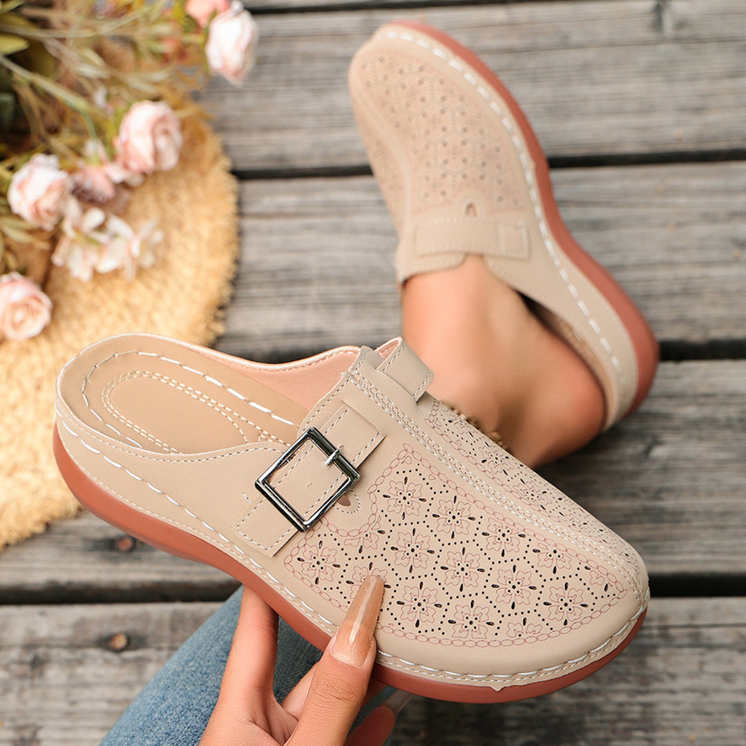 Women's comfort mule with adjustable buckled strap and ornamental hole embossing Mune Fashion