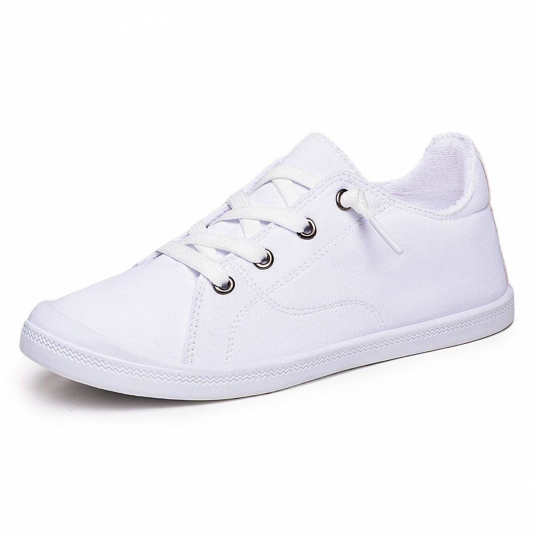 Women’s classic canvas low-top sneakers with reinforced rubber sole, metal eyelets, and padded heel collar Mune Fashion