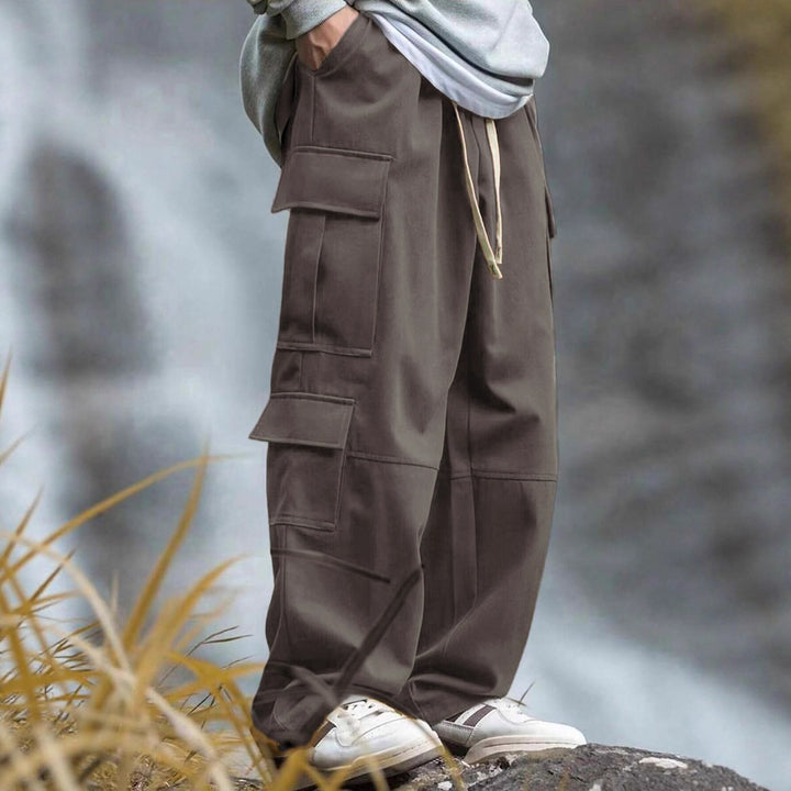 Men's casually cut multiple pockets cargo pants with wide leg and prominent knee darts Mune Fashion