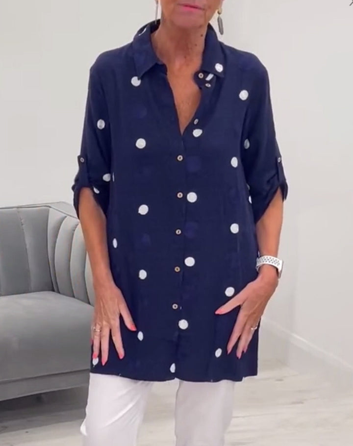 Women's long cut polka dot tunic with shirt collar, continuous button placket and sleeve tabs Mune Fashion