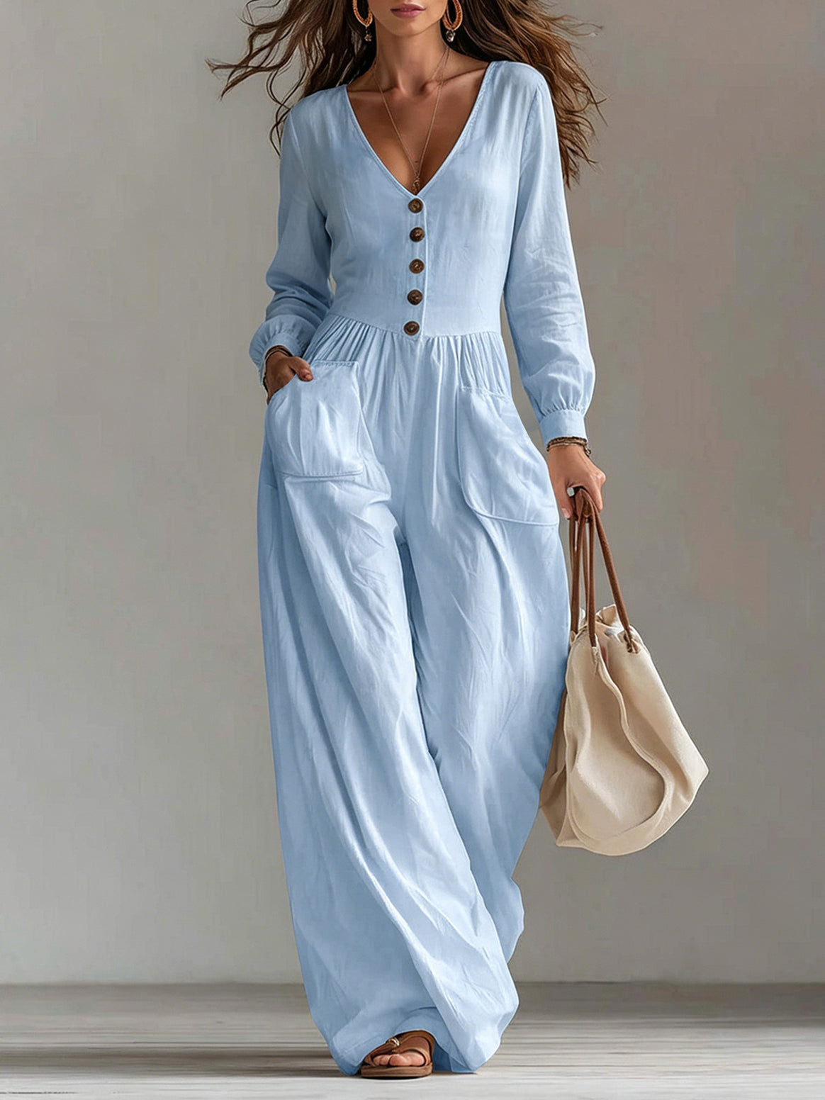 Ladies linen jumpsuit with V-neck, button placket and wide leg cut Mune Fashion