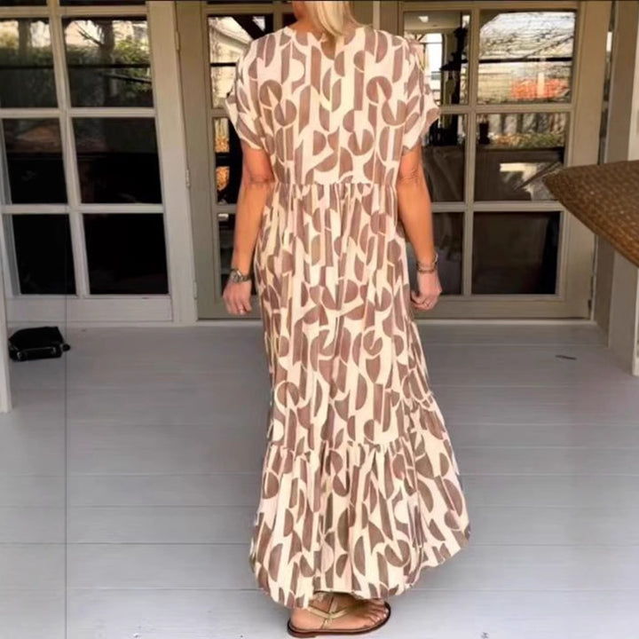 Women's voluminous maxi dress with under-bust seam, V-neck, short kimono sleeves, and tiered ruffle Mune Fashion