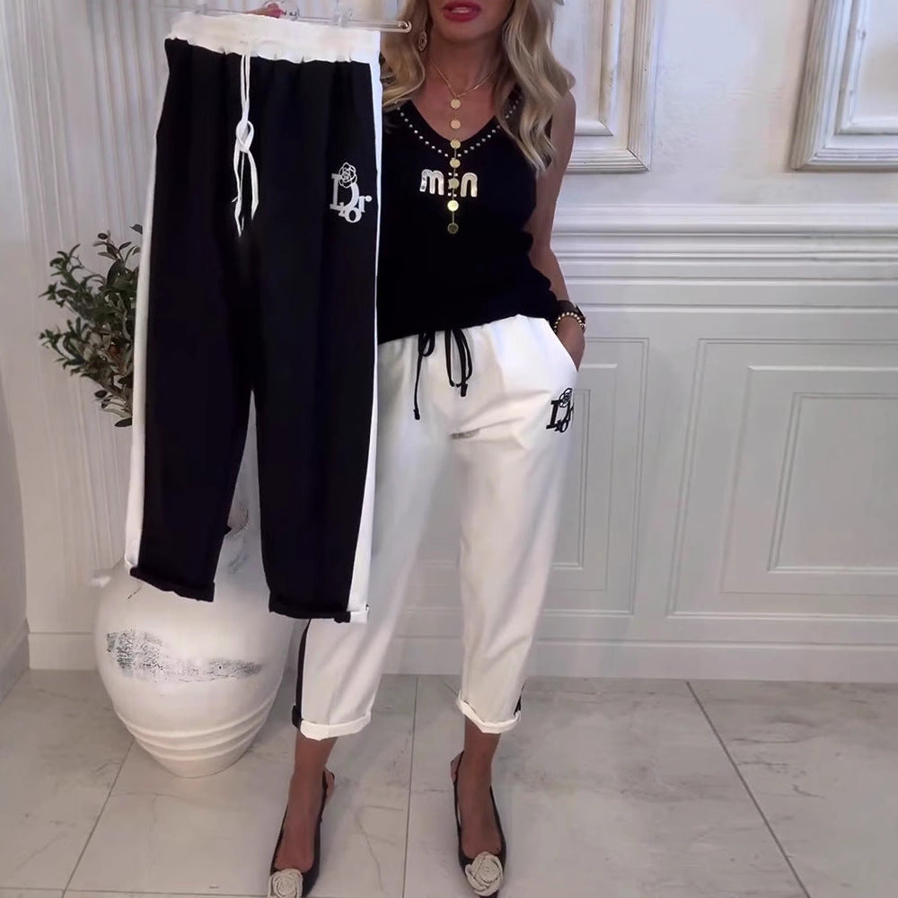 Women's cropped comfort joggers with side contrast stripes, elastic drawstring waist, and logo embroidery Mune Fashion