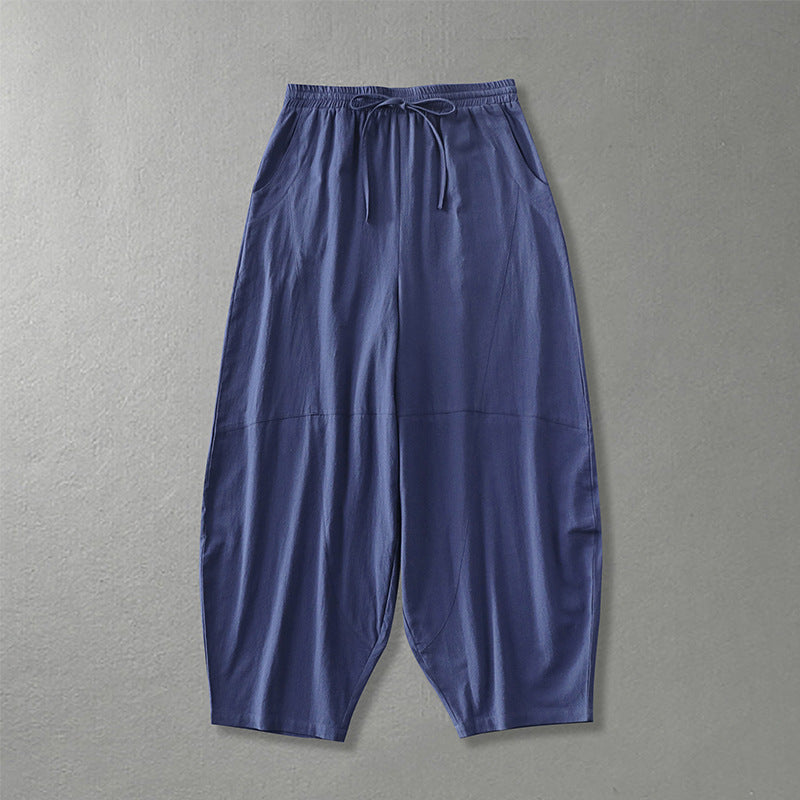 Women's wide harem pants made of lightweight satin with drawstring and side pockets Mune Fashion