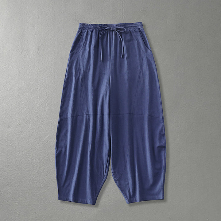 Women's wide harem pants made of lightweight satin with drawstring and side pockets Mune Fashion