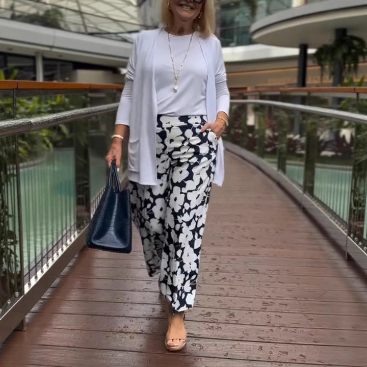 Women's wide Palazzo pants with large floral print, high waistband and side pockets Mune Fashion