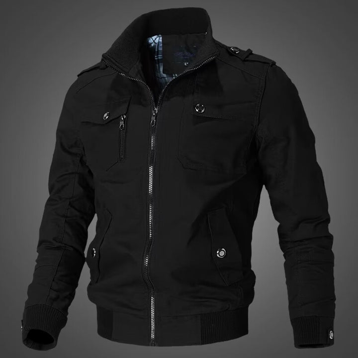 Men's tailored canvas bomber jacket with stand-up collar, zip front, shoulder patches, and functional pockets