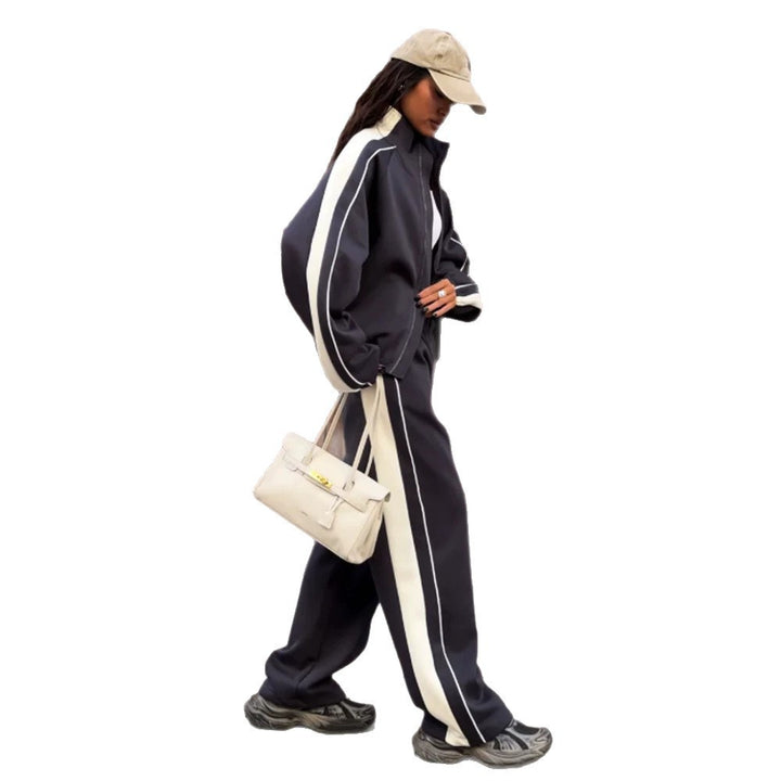 Women's oversized tracksuit with zip jacket, wide joggers, and contrast side stripes Mune Fashion