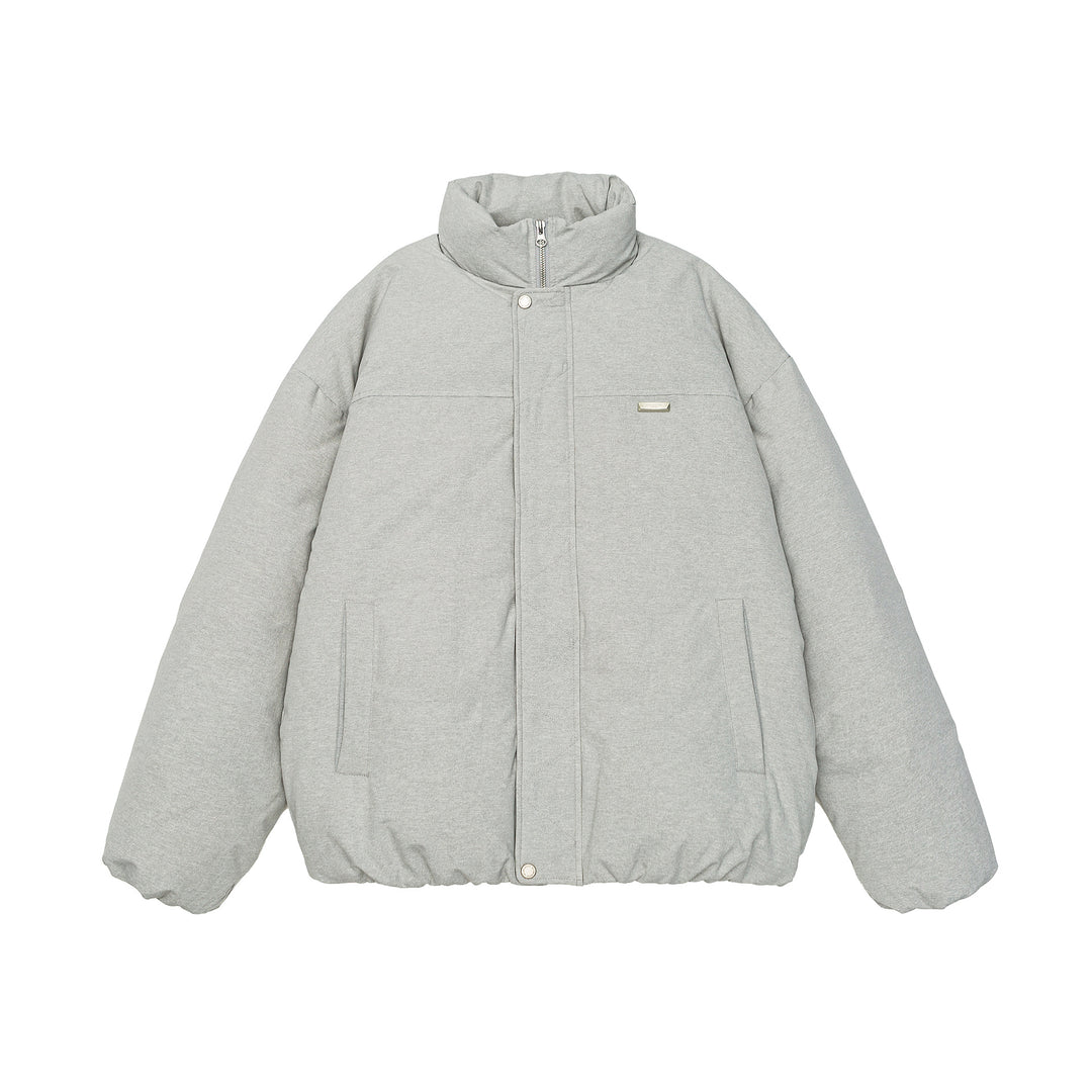 Women short cut oversized quilted jacket with high stand-up collar and concealed zipper Mune Fashion