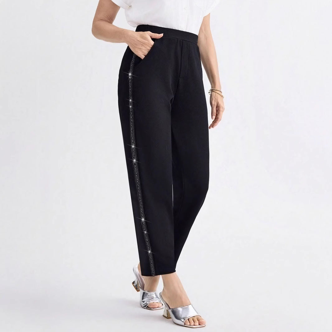 Women Elegant straight-cut fabric pants with elastic waistband and side glitter trim Mune Fashion