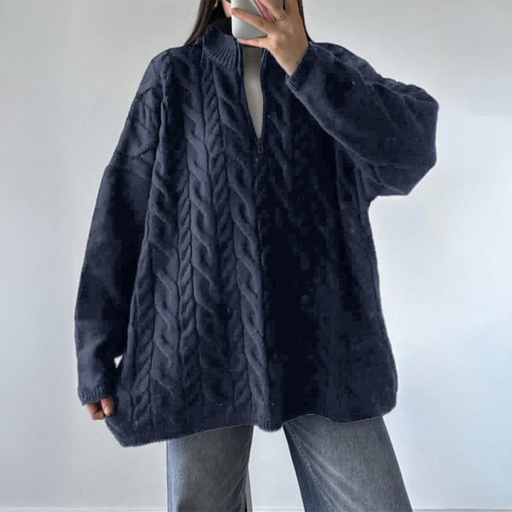 Women's oversized cable knit turtleneck sweater with half zip, high stand-up collar, and rounded hem Mune Fashion