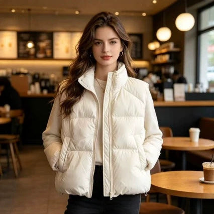 Women's short padded puffer jacket with high stand-up collar and practical side pockets Mune Fashion