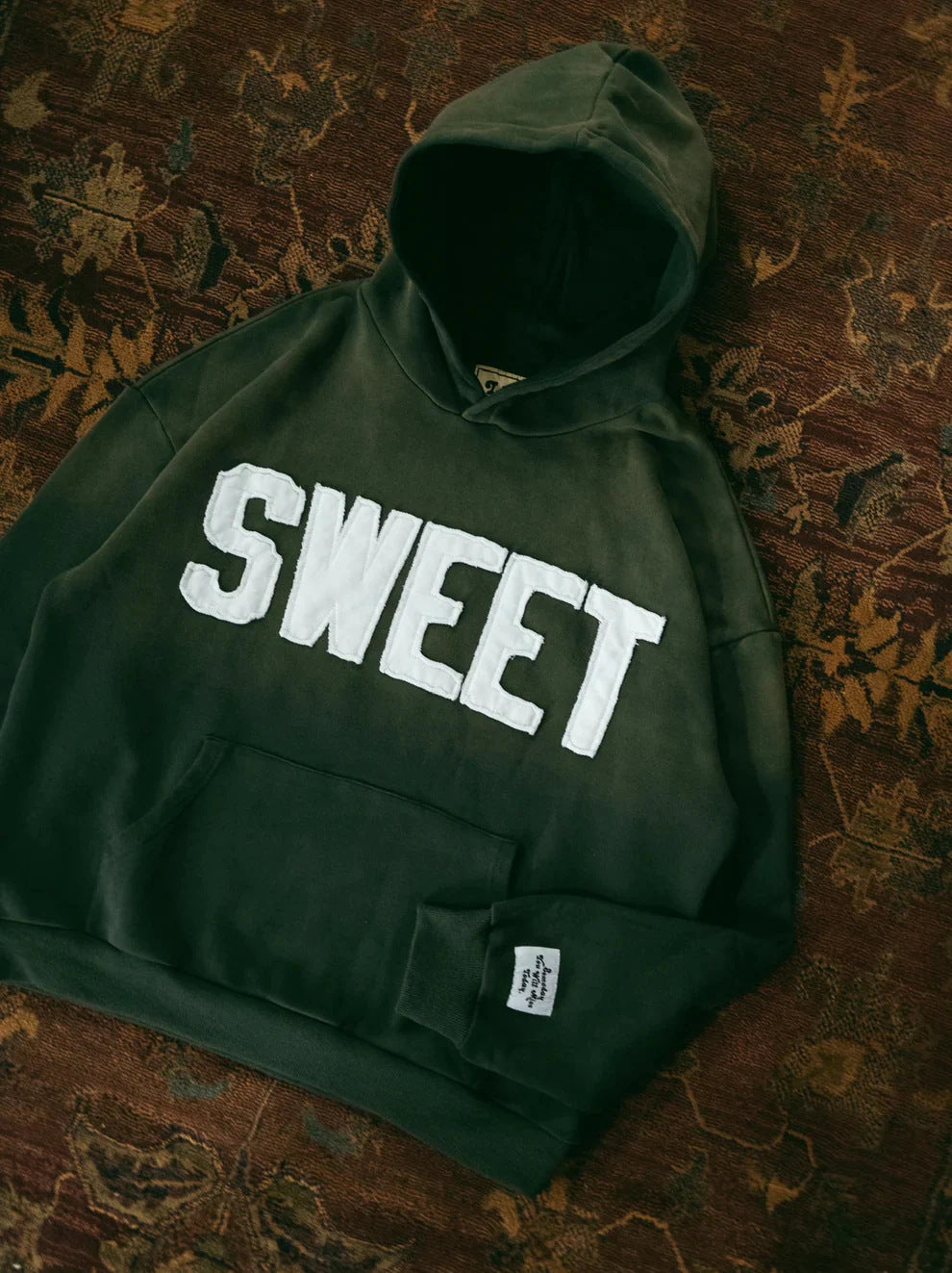 Unisex nan oversized hoodie with appliquéd letter patches and kangaroo pocket Mune Fashion
