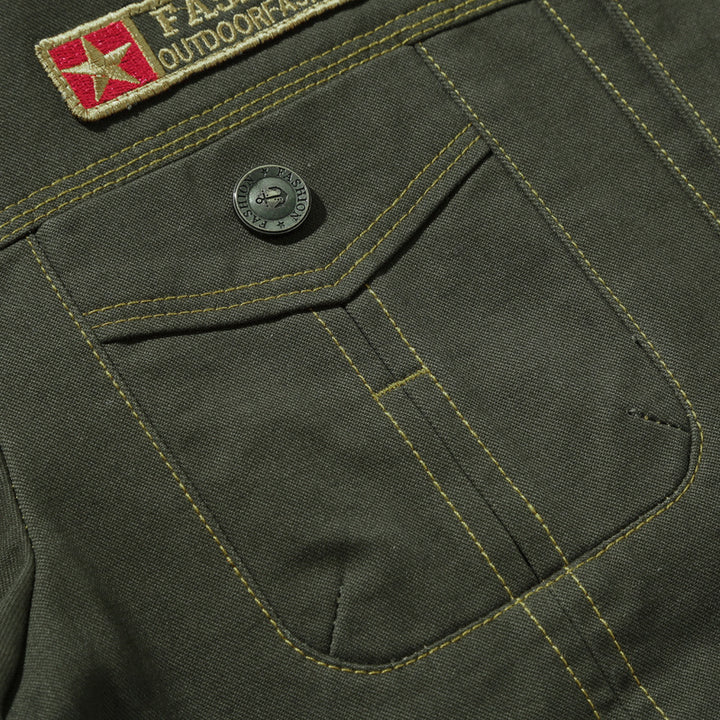 Men's robustly crafted canvas work jacket with breast flaps, inner seam lining, and badge details Mune Fashion