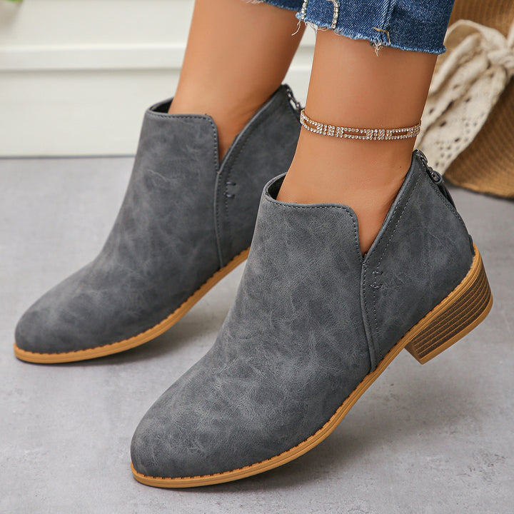 Women ankle-high booties with V-cut, back zip tassel, and stacked block heel Mune Fashion