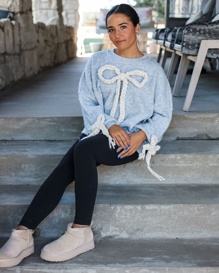 Ladies' Fashionable Sweater with Decorative Knot Design