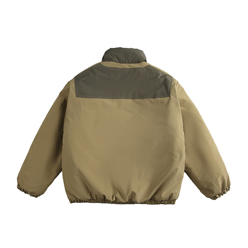 Unisex Boxy padded stand-up collar jacket with contrast panels, vertical chest zippers, and large flap pockets Mune Fashion