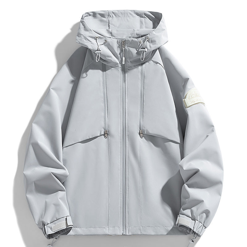 Unisex Lightweight two-tone wind and rain jacket with hood, drawstring and zip pockets Mune Fashion