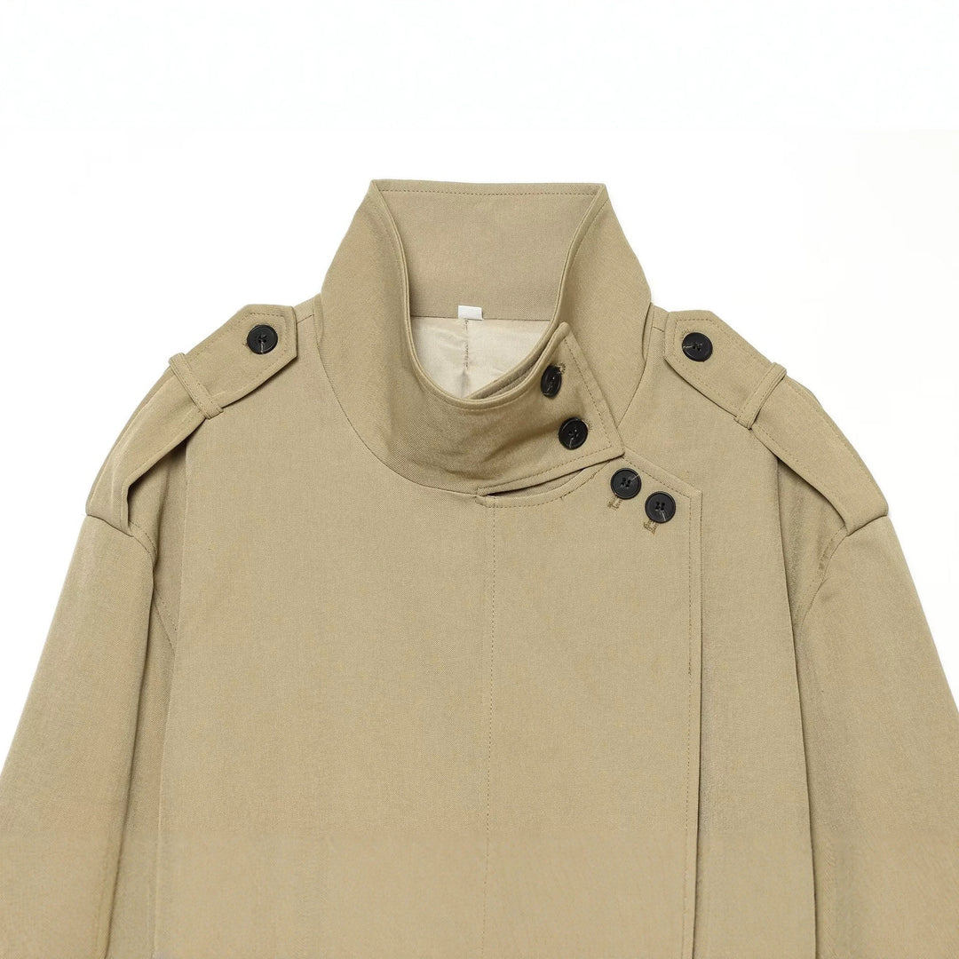 Women's short trench coat with high standing collar, waist belt and shoulder flaps Drune