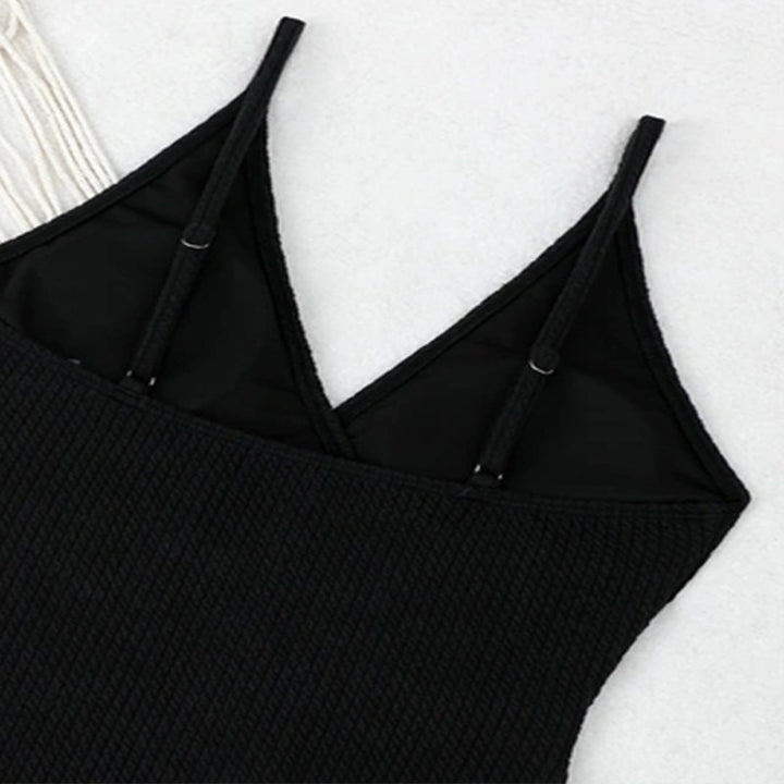 Ladies one-piece swimsuit with elegant wrap design and decorative ring Mune Fashion