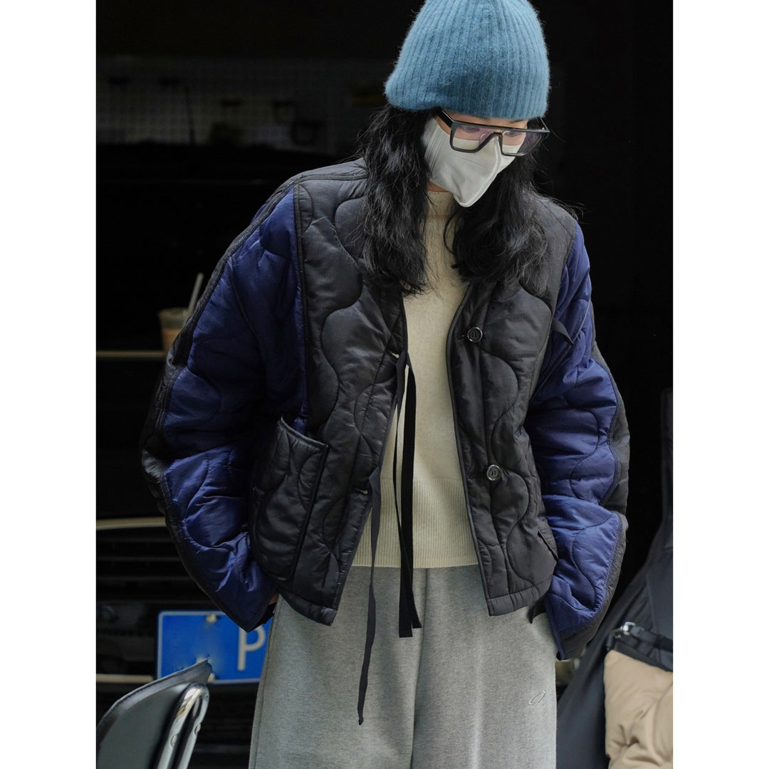 Women's Padded Oversized Quilted Jacket with Contrasting Sleeves and Button Placket Mune Fashion