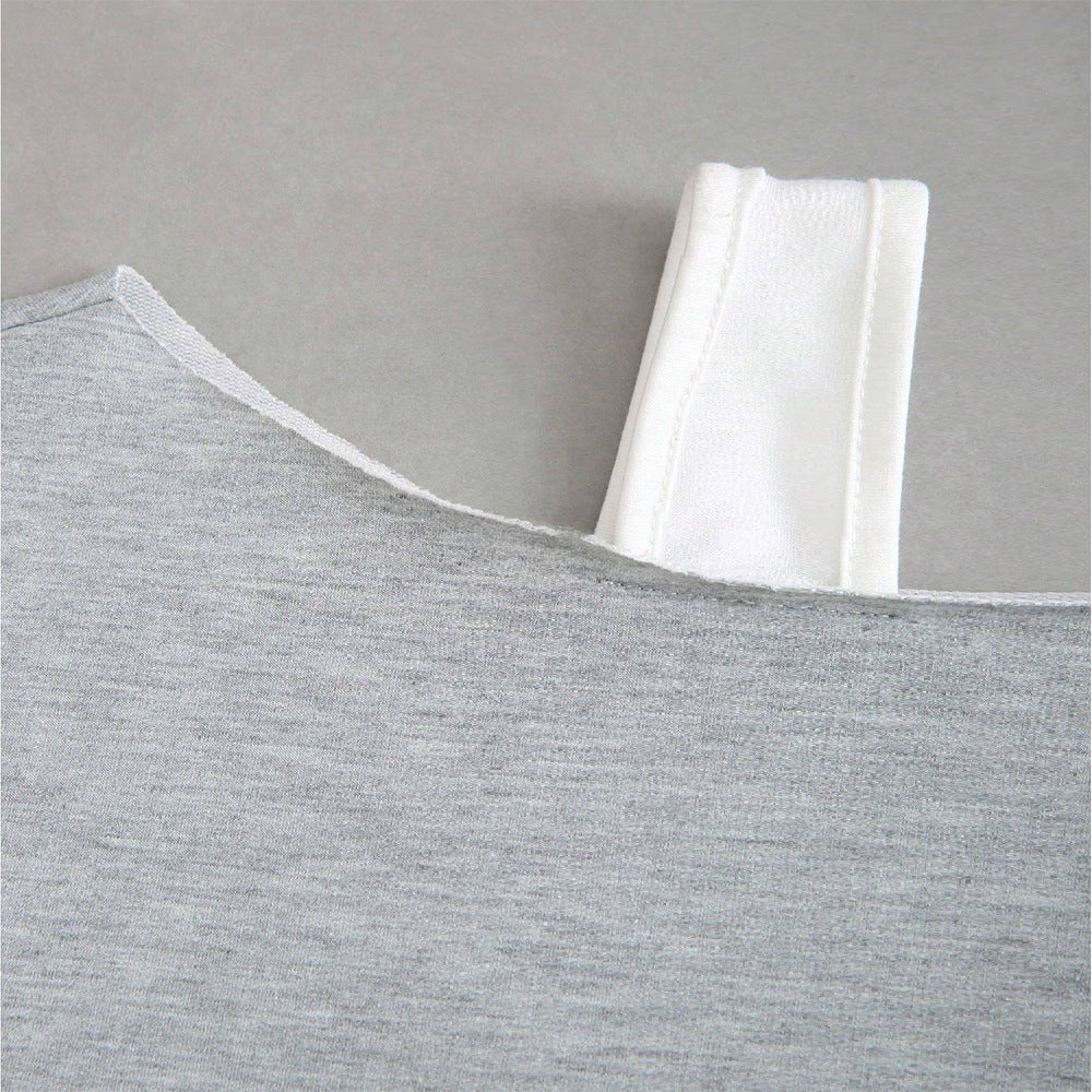 Women's cropped off-shoulder sweatshirt with one-sided strap, balloon sleeves, and ribbed cuffs.