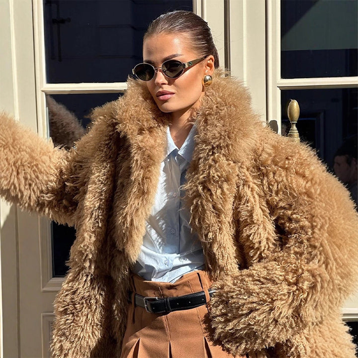 Women’s short coat made of voluminous bouclé faux fur with wrap and waist belt Mune Fashion