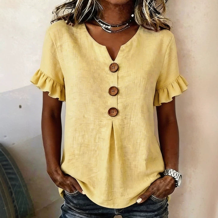Women's top with ruffled hems and button details Mune Fashion