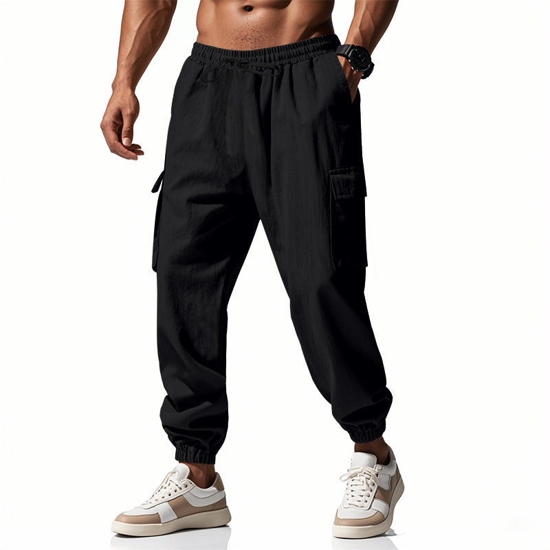 Men's tapered joggers in utilitarian style with elastic waistband, drawstring, and flap pockets Mune Fashion