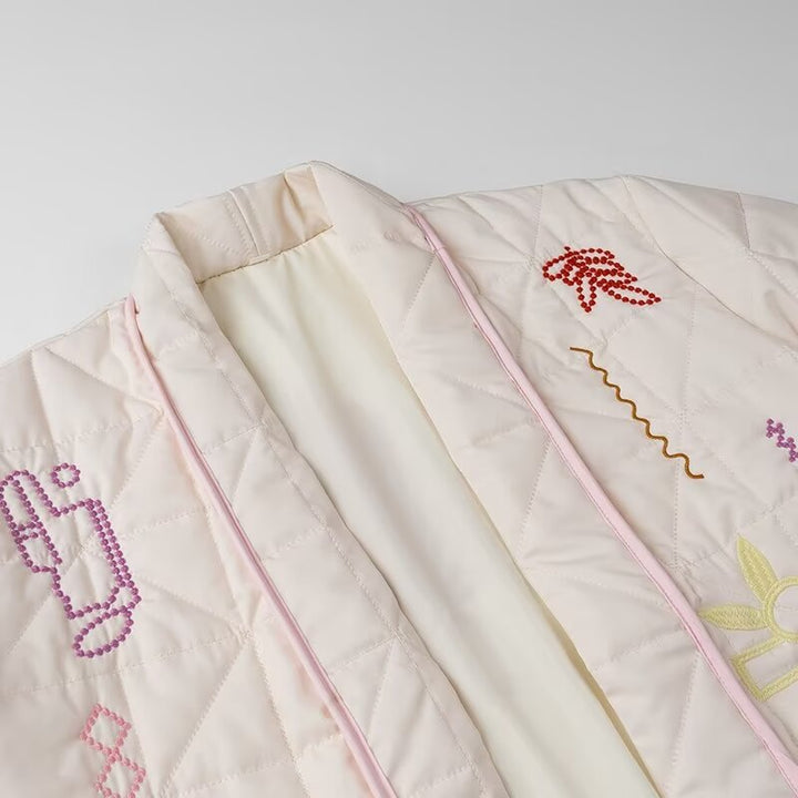 Women's padded kimono jacket with decorative embroidery, open front and patch pockets Mune Fashion