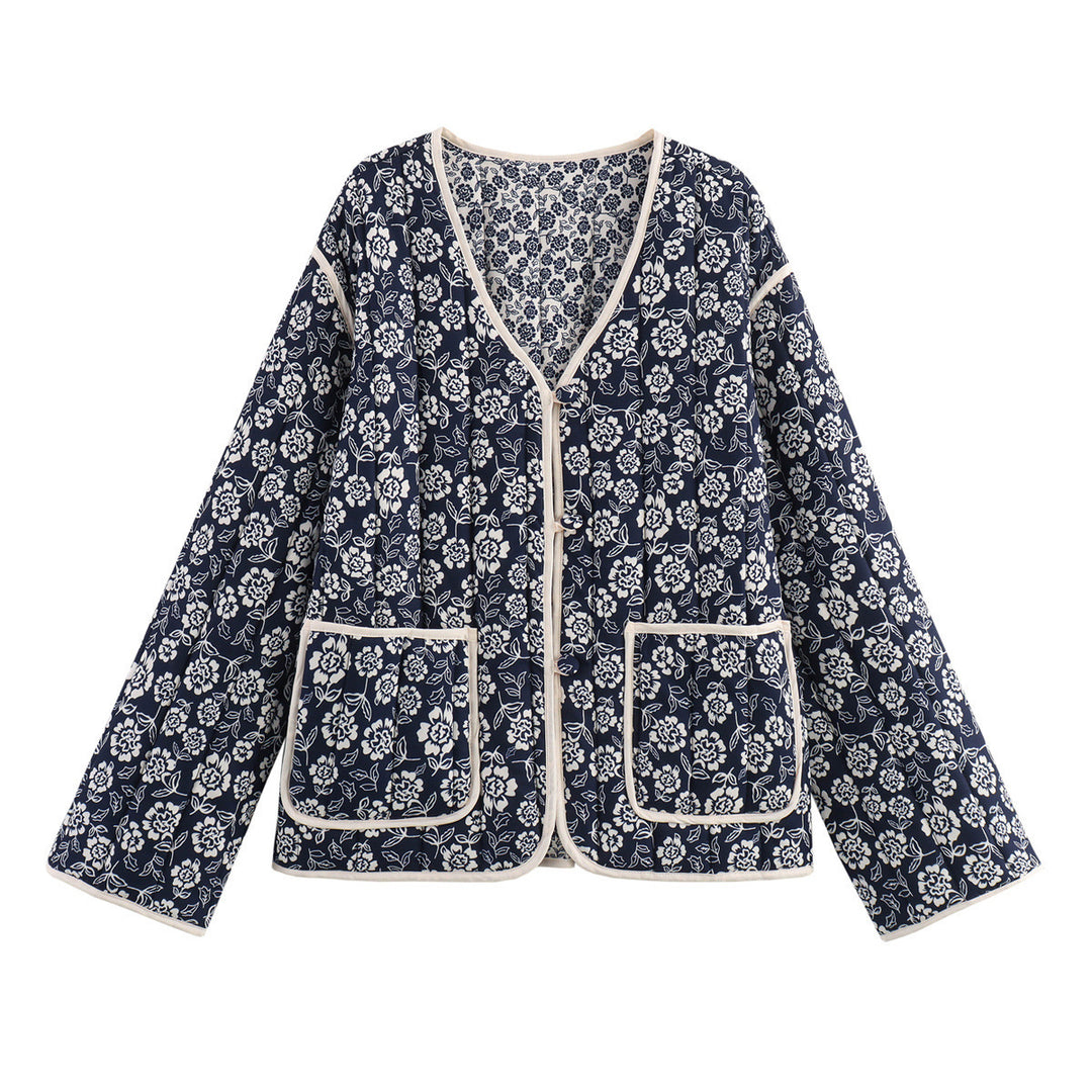 Ladies quilted jacket with floral allover, V-neck, contrast piping and patch pockets Mune Fashion