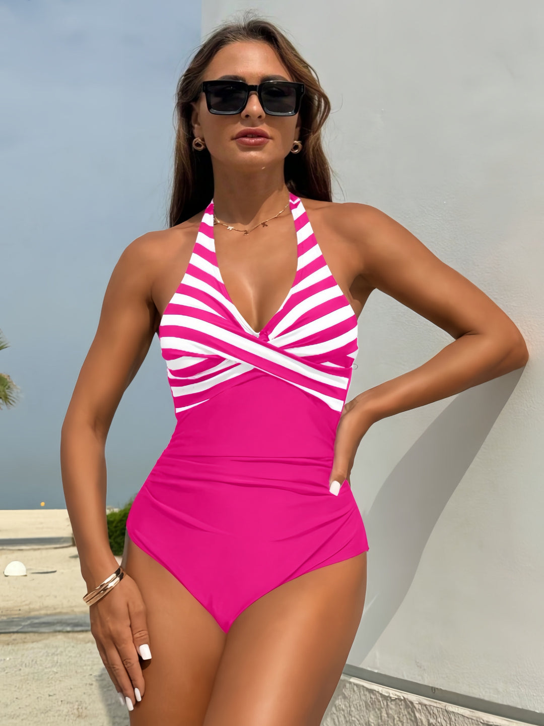 Women's one-piece swimsuit with elegant wrap design and vertical stripes Mune Fashion