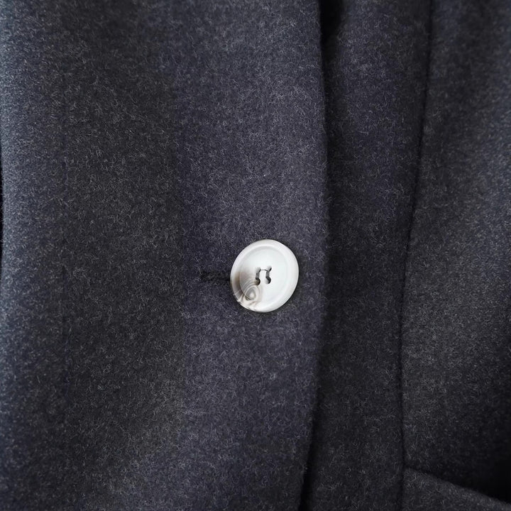 Women's elegant long-cut coat with shawl collar, tailored princess seams, and concealed single-button front Mune Fashion
