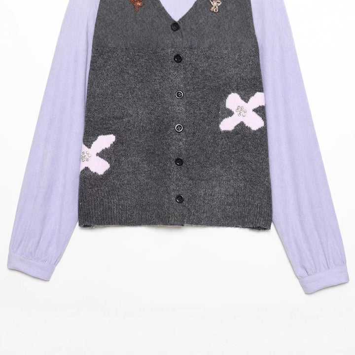 Women's knitted cardigan with decorative flower appliqué and contrast sleeves Mune Fashion
