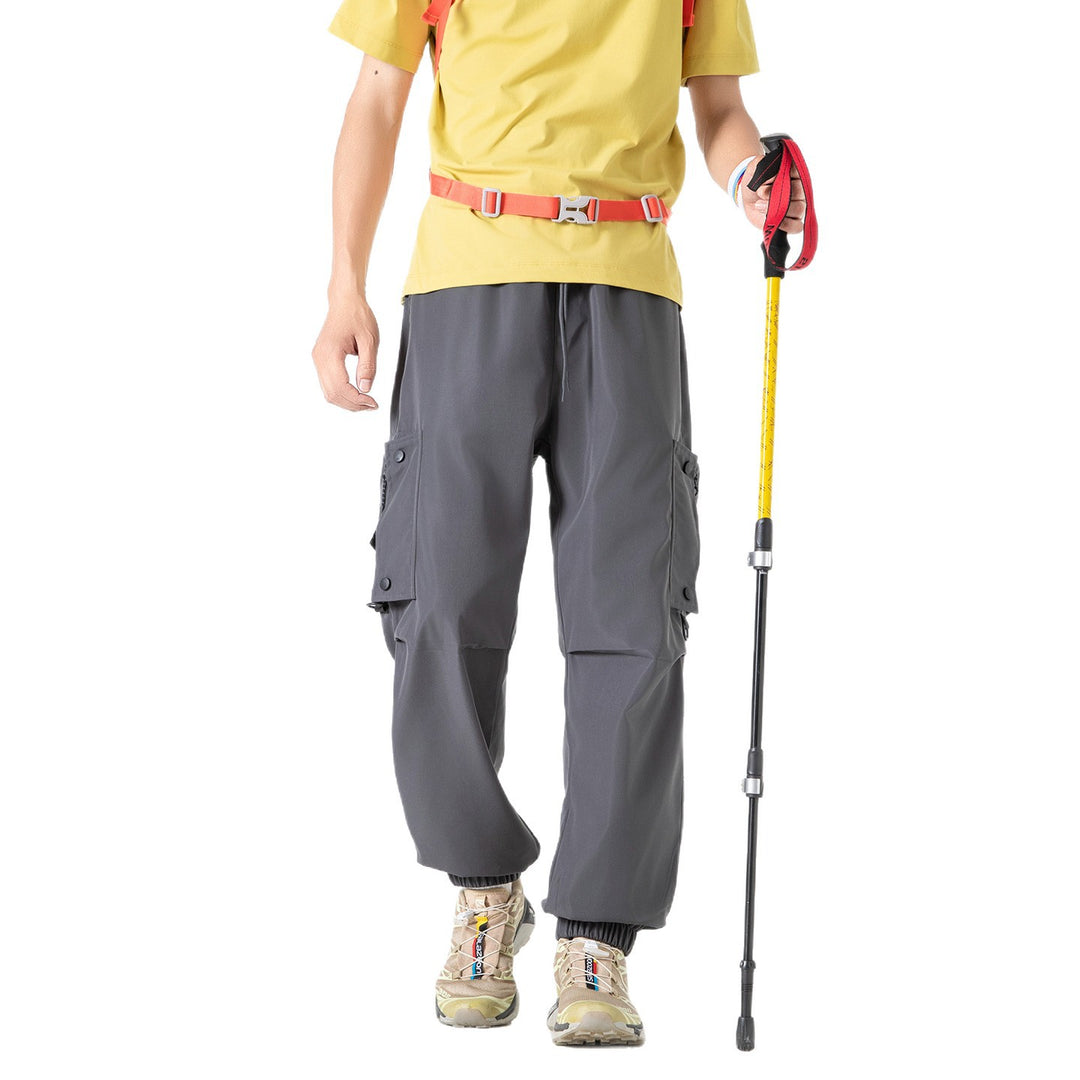 Men's Wide Technical Cargo Jogger with elastic drawstring waistband, multifunctional cargo pockets and adjustable leg openings Drune
